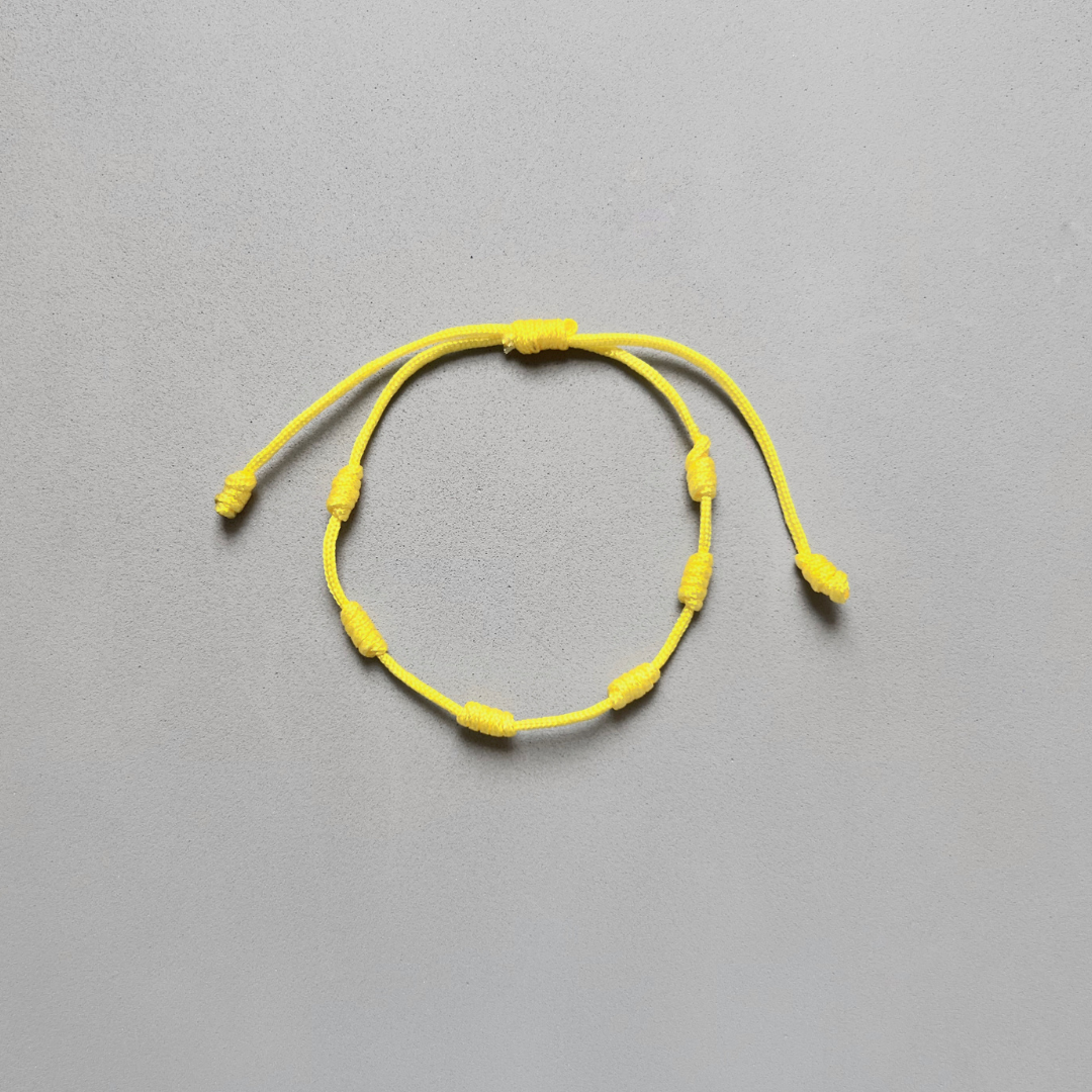 PULSERA DE 7 NUDOS AMARILLO