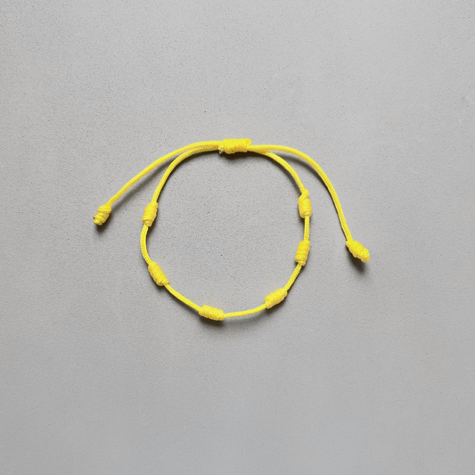 PULSERA DE 7 NUDOS AMARILLO